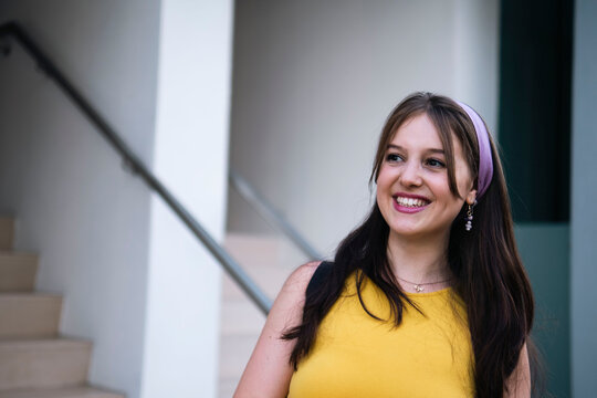 Happy Young Woman With Long Hair Wearing Headband