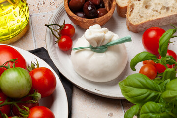 Burrata cheese, various tomatoes and olives