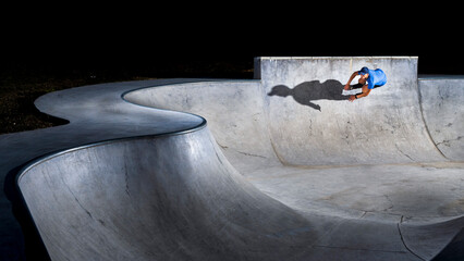 Man practicing inline skating at skateboard park