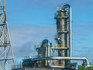 Fractionating column at an oil refinery. Production equipment at a petrochemical plant. Oil...