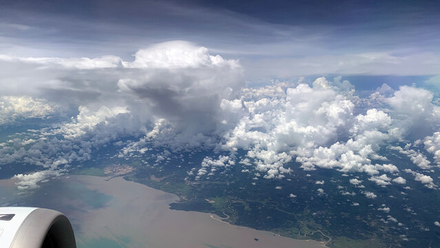 Aerial view of a plane flying over coastline of Myanmar
