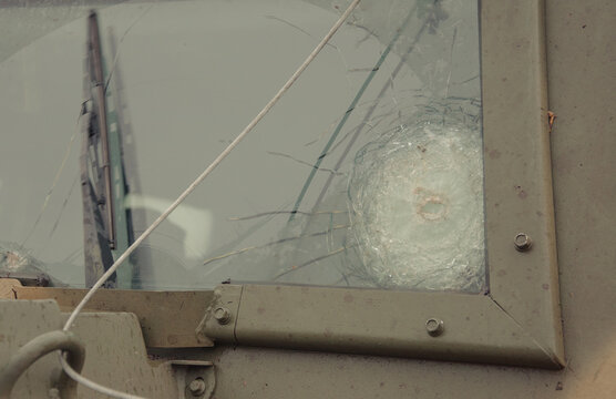 Kyiv, Ukraine – 09/05/2022: The armored glass of a military car with bullet marks