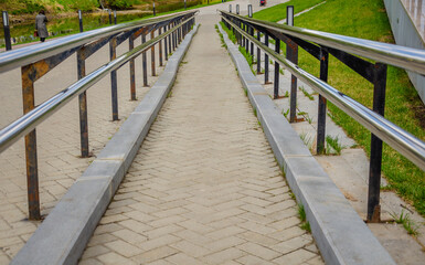 Obraz premium A long path with an iron railing.