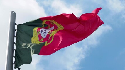 Portugal, flag is fluttering in the wind photo on the background of the sky, outdoors. National flag