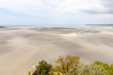 Beautiful view from the Mont Saint-Michel Abbey to the Atlantic Ocean at low tide. France