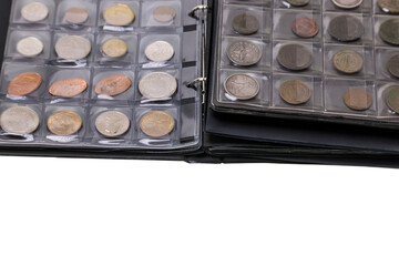 View of album with collectible old coins from different countries. Numismatic concept.  Sweden.