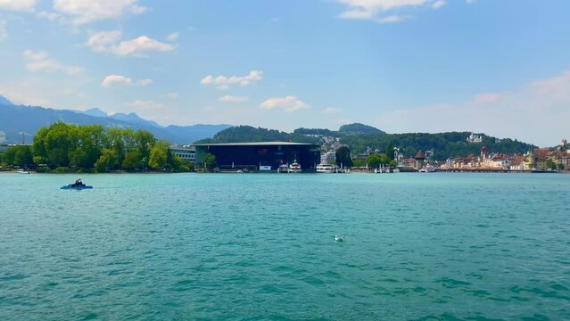 Travel on Lake Lucerne with Mountain View and City of Lucerne in a Sunny Summer Day in Lucerne, Switzerland.