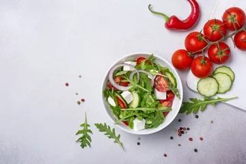 Foto op Plexiglas Healthy vegetarian salad with fresh arugula, cherry tomatoes, soft cheese and cucumbers © viktoriya89