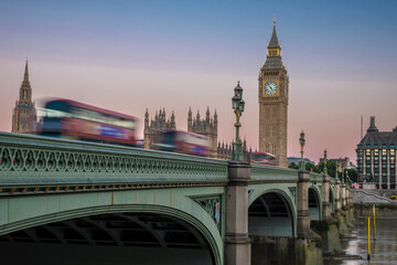 Three buses speed across Westminster Bridge