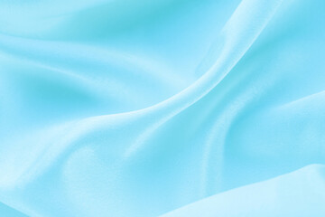 folds of blue silk fabric texture background