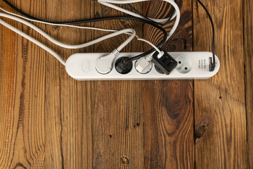 Power Strip, Extension Cable on Wooden Background