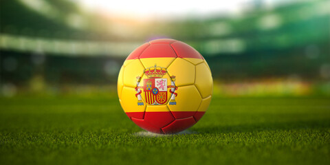 Football ball with flag of Spain on the field of football stadium and space for name of football clubs. Football championship of Spain concept.