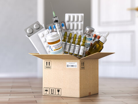 Open cardboard box with medicines and healthcare medication. Buying and delivery medications concept.