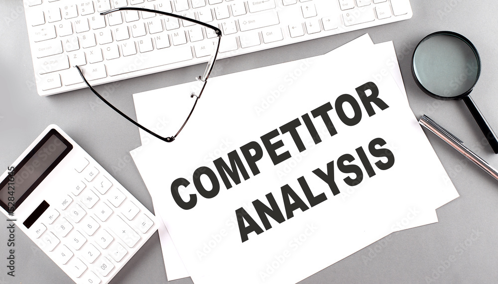 Poster competitor analysis text on paper with keyboard, calculator on grey background