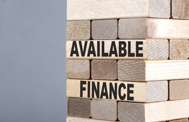 The text on the wooden blocks AVAILABLE FINANCE