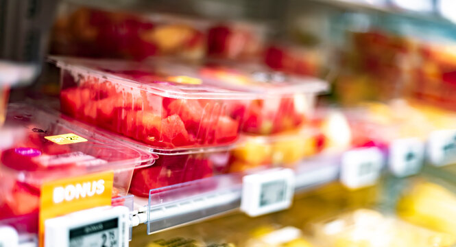Packages with fruits displayed in a commercial refrigerator