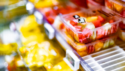 Packages with fruits displayed in a commercial refrigerator