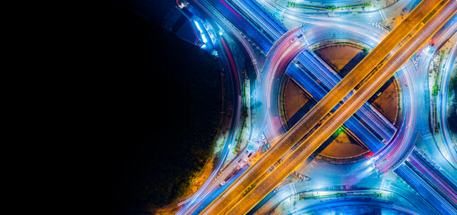 Expressway top view, Road traffic an important infrastructure,car traffic transportation above intersection road in city night, aerial view cityscape of advanced innovation, financial technology	
