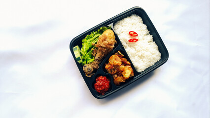 nasi kotak ayam goreng. rice box fried chicken