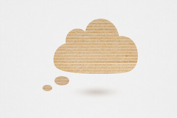 blank cloud bubble speech brown cardboard grunge paper cut on grunge grey background with copy...