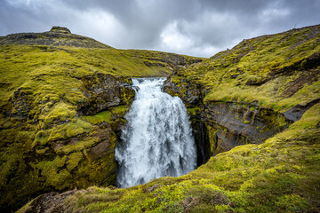 Waterfall in mountains, Iceland