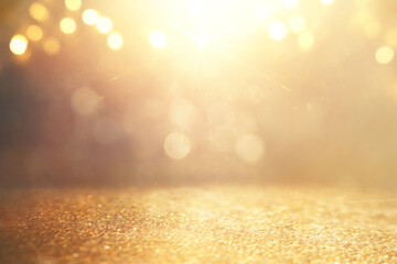 background of abstract gold and silver glitter lights. defocused - obrazy, fototapety, plakaty