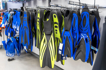 new fins for swimming on sale in a sports store. Active recreation