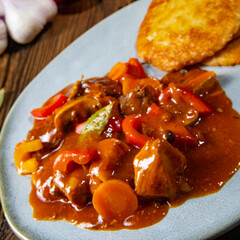 Hungarian goulash with potato pancakes