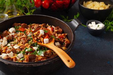 Traditional Greek cuisine. Lamb stew with feta cheese and vegetables.