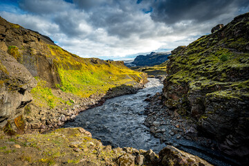 Fototapeta na wymiar river and country volcanic landscape with rocks, Iceland