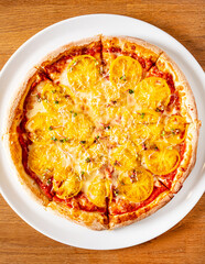 tasty pizza on the wooden background