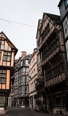 Fototapeta premium Street scene with historical buildings in Rouen France. Old traditional houses normandy.