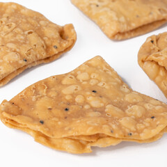 Namak para or Nimki on white background. A Traditional Indian food.