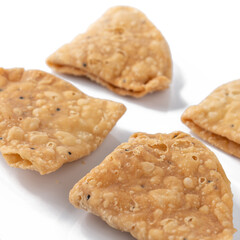 Namak para or Nimki on white background. A Traditional Indian food.