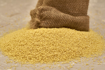 croup couscous poured out of a canvas bag on the table