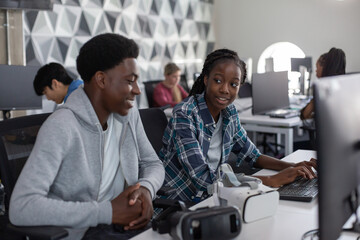 High school students computer programming in class