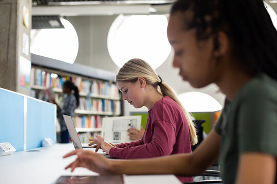 High School Students Studying Together In A Library