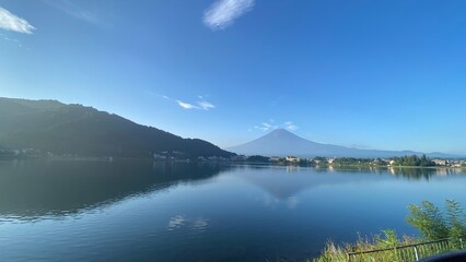 Fototapeta premium 6:25am Mt Fuji view with barely any snow on top or clouds, a beautiful day in August 27th, 2022 Kawaguchiko lakeshore, Yamanashi prefecture