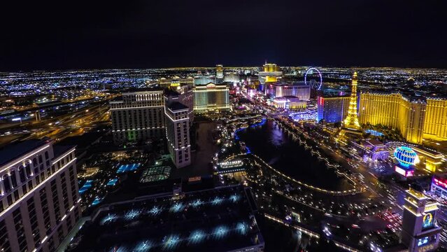 Aerial Time Lapse Shot Of Illuminated Famous Landmarks In City Against Clear Sky At Night - Las Vegas, Nevada