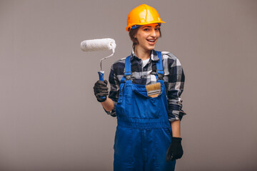 Portrait of repair woman with painting roller  