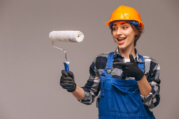 Portrait of repair woman with painting roller  