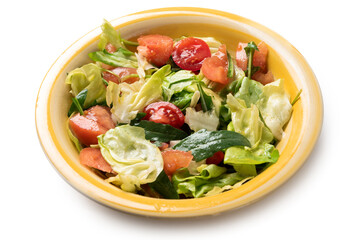 Piatto di insalata mista con lattuga, pomodoro, rucola e olio di oliva 