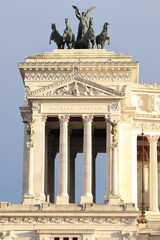 Fototapeta premium Vittoriano National Monument Detail with Columns and Bronze Group of Statues in Rome, Italy