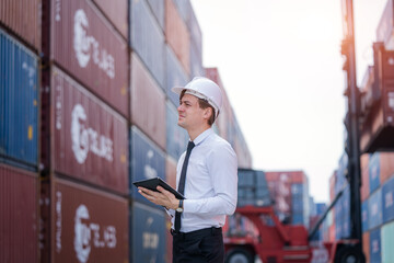 Manager checking stock into container for loading at container yard warehouse,Logistic shipping...
