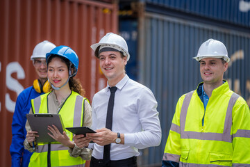 Technicians or engineer with worker planning the transportation for import or export in the container yard warehouse,Container yard warehouse inspection.