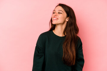 Young caucasian woman isolated on pink background relaxed and happy laughing, neck stretched showing teeth.