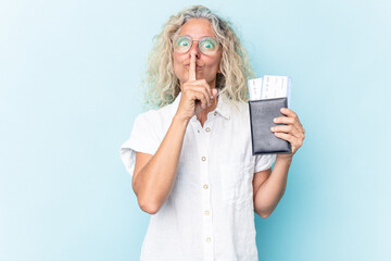 Middle age caucasian woman holding a passport isolated on white background keeping a secret or...