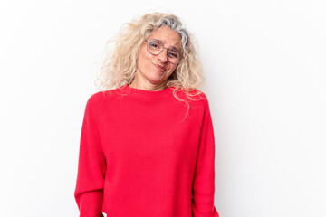 Middle age caucasian woman isolated on white background shrugs shoulders and open eyes confused.