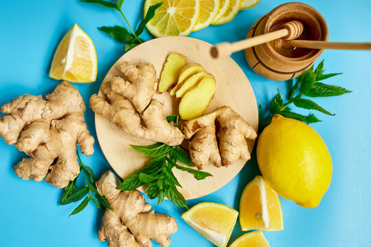  Immune Boosting Remedy, Immunity Boosting Foods Ginger, Lemon,  Honey,  Mint On Blue Background, Flat Lay Top View, Copy Space.