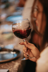Red wine by the glass at a tasting of white, rosé and red wines that celebrates friendship and joy at the highest level with your best friends on a weekend evening full of people from social media.
